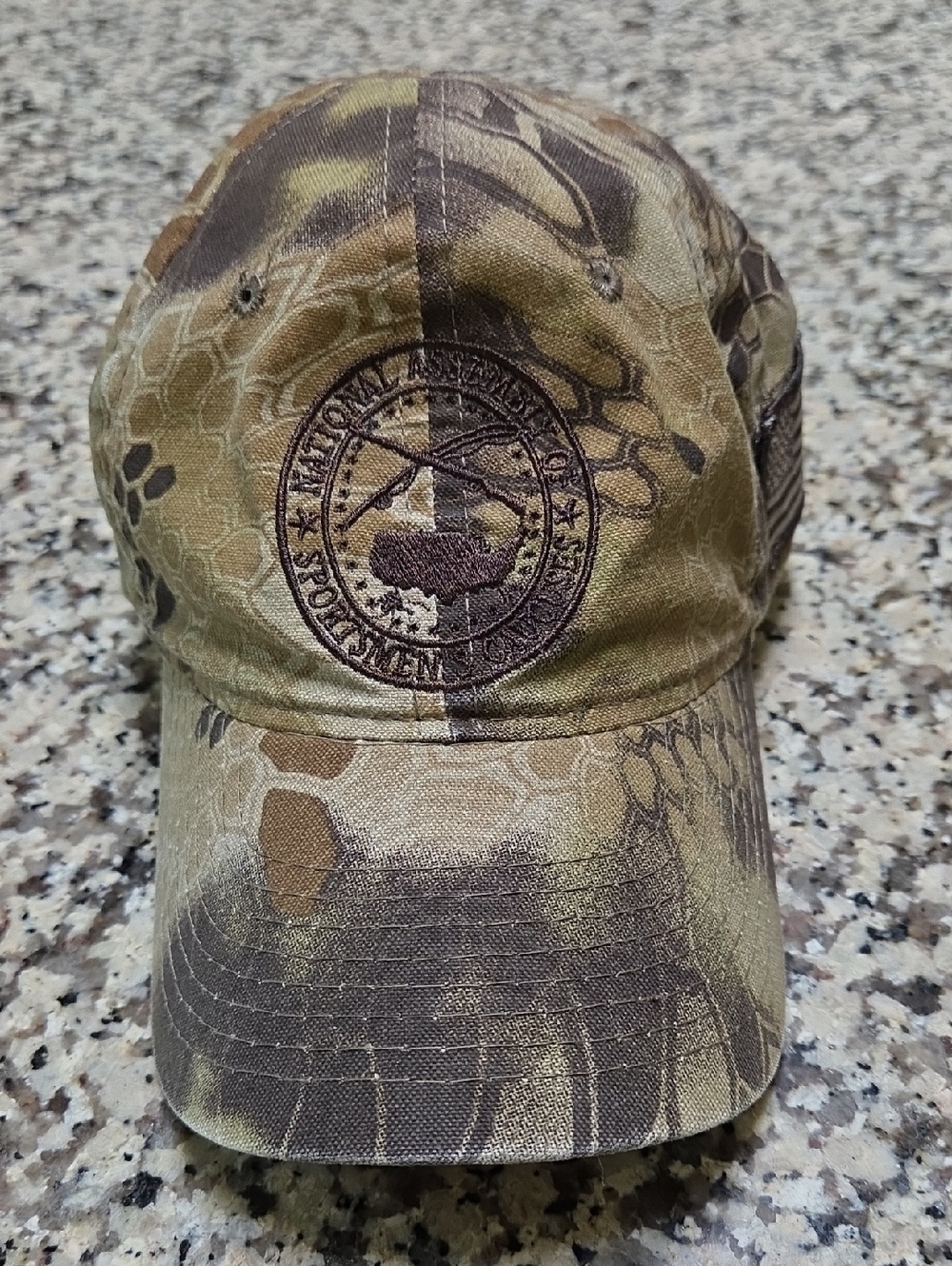 Kryptek Highlander camouflage hat featuring a circular patch for the Nation